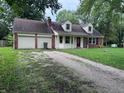 Charming single-Gathering home with brick accents, dormer windows and an attached two-car garage at 2934 S Irwin St, Indianapolis, IN 46203