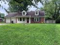 Charming single-Gathering home with brick accents, dormer windows and an attached two-car garage at 2934 S Irwin St, Indianapolis, IN 46203