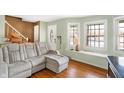 Spacious living room featuring a large sectional sofa and wood floors at 2934 S Irwin St, Indianapolis, IN 46203