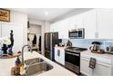 Modern kitchen with white cabinets and stainless steel appliances at 3844 Albert Ln, Bargersville, IN 46106