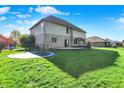 A spacious, grassy backyard is perfect for outdoor play at 386 White Oak Ln, Greenwood, IN 46142