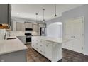 Spacious kitchen with gray cabinets, white countertops and island featuring stainless steel appliances at 386 White Oak Ln, Greenwood, IN 46142