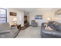 Living room with gray sofa and armchair at 4314 London Ct, Anderson, IN 46013