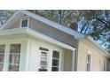 Tan colored siding and white trim accents at 4712 Caroline Ave, Indianapolis, IN 46205