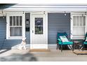 Cozy front porch with seating and decorative 