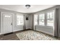 Bright living room featuring large windows and modern flooring at 4926 Crittenden Ave, Indianapolis, IN 46205