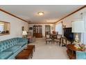 Open living and dining area with wood furniture at 710 Eagle Pkwy # 15, Brownsburg, IN 46112