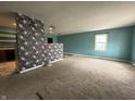 Cozy living room with adjoining kitchen and neutral carpet at 7903 Roseway Ct, Indianapolis, IN 46226