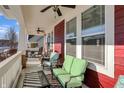 Relaxing front porch with rocking chairs and a glass-top coffee table at 8758 Carver Dr, Indianapolis, IN 46239