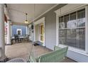 Spacious front porch featuring a porch swing and rocking chairs, offering a relaxing outdoor space at 1319 N New Jersey St, Indianapolis, IN 46202