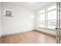 Bright home office featuring hardwood floors and large windows at 20035 Meadow Neck Rd, Westfield, IN 46074