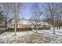 Ranch house with brick and siding exterior, surrounded by trees at 2054 Horizon Blvd, Greenwood, IN 46143