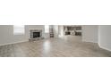 Spacious living room featuring a fireplace and hardwood floors, open to kitchen at 6250 Bales Dr, Plainfield, IN 46168