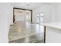Open concept living room with hardwood floors, and view to kitchen at 1022 Villa Ave, Indianapolis, IN 46203