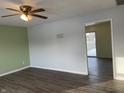 Bright living room with wood-look floors and two-tone walls at 1360 S Cherry St, Martinsville, IN 46151