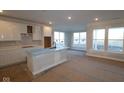 Spacious kitchen featuring white cabinets, quartz countertops, and an island at 3617 Wrangler Dr, Bargersville, IN 46106