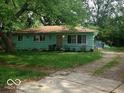 Ranch home with light blue siding, and a spacious yard at 4009 Beauport Rd, Indianapolis, IN 46222