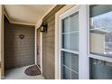 Front entry with door, window, and exterior light fixture at 4669 Stansbury Ln, Indianapolis, IN 46254