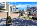 Beautiful townhome exterior with a two-car garage and landscaped driveway at 4669 Stansbury Ln, Indianapolis, IN 46254