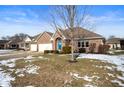 Brick ranch home with attached garage, and a tree in the front yard at 5756 Kensington S Way, Plainfield, IN 46168