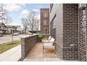 Small brick patio with seating area in front of the building at 1234 Alabama St, Indianapolis, IN 46202