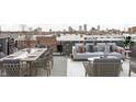 Rooftop deck with city views, seating, and dining area at 1234 Alabama St, Indianapolis, IN 46202