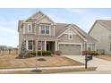 Two-story home with a manicured lawn, attractive landscaping, and inviting curb appeal at 15349 Eastpark W Cir, Fishers, IN 46037