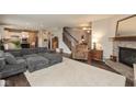 Spacious living room with fireplace, plush seating, and open-concept layout at 15349 Eastpark W Cir, Fishers, IN 46037
