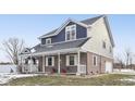 Two-story house with gray and blue siding, covered porch, and attached garage at 5371 Lue Ann Ln, Mooresville, IN 46158