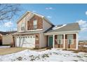 Two-story house with a white garage door and green front door at 6350 W Chelmsford Dr, McCordsville, IN 46055