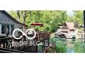 Beautiful waterfront home with stunning lake views, stone facade, and spacious deck for outdoor entertaining at 7018 Drum Dr, Nineveh, IN 46164