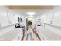 Bright kitchen features white cabinets, stainless steel appliances, and stylish countertops at 7468 Prairie Lake Dr, Indianapolis, IN 46256