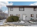 Two-story townhome with light gray siding, and a white door at 7906 Benjamin Dr, Indianapolis, IN 46226