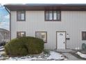 Two-story townhome with light gray siding, and a white door at 7906 Benjamin Dr, Indianapolis, IN 46226