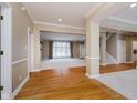 Hardwood floors and view into living room and staircase at 10295 Summerlin Way, Fishers, IN 46037