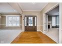 Bright and spacious entryway with hardwood floors and views to other rooms at 10295 Summerlin Way, Fishers, IN 46037