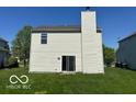 Back of house, showing sliding glass doors and chimney at 11663 Congressional Ln, Indianapolis, IN 46235