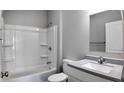 Clean bathroom with a shower/tub combo and vanity at 1407 N Pershing Ave, Indianapolis, IN 46222