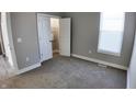 Simple bedroom with carpeted floor and a closet at 1407 N Pershing Ave, Indianapolis, IN 46222