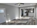 Spacious living room with hardwood floors and kitchen view at 1407 N Pershing Ave, Indianapolis, IN 46222