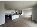 Bright, open kitchen features white cabinets and center island at 19983 Boulder Brook Ln, Westfield, IN 46074