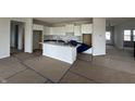 New kitchen with white cabinets and a center island under construction at 19983 Boulder Brook Ln, Westfield, IN 46074