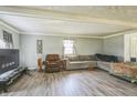 Living room with hardwood floors, sectional sofa, and recliner at 2003 S Bolton Ave, Indianapolis, IN 46203