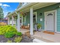 Inviting front porch with hanging plants and comfortable seating at 2015 Columbia Ave, Indianapolis, IN 46202