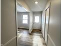 Bright entryway with wood-look floors and coat closet at 2526 Pleasant W Way, Carmel, IN 46280