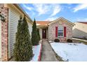 Brick front entry with walkway and landscaping at 3418 Capsella Ln, Indianapolis, IN 46203