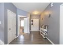 Bright entryway with gray walls and hardwood floors at 4046 Stubbington Ln, Indianapolis, IN 46239