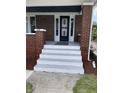 Front porch with painted steps and a security door at 448 N Gray St, Indianapolis, IN 46201
