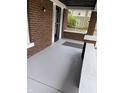 Painted porch with brick columns and a security door at 448 N Gray St, Indianapolis, IN 46201