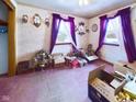 Empty bedroom with purple walls and pink carpet, ready for your furniture! at 4712 Southern Ave, Anderson, IN 46013